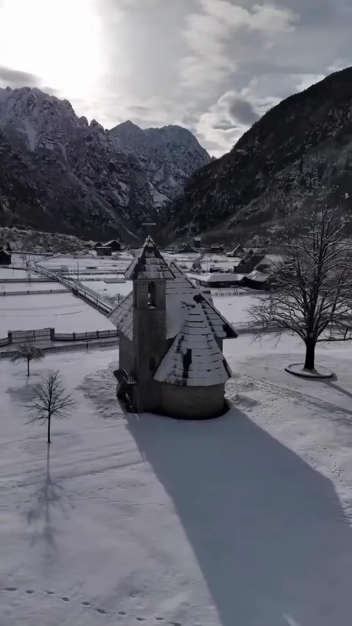 Snow-covered village and mountains in the Albanian Alps